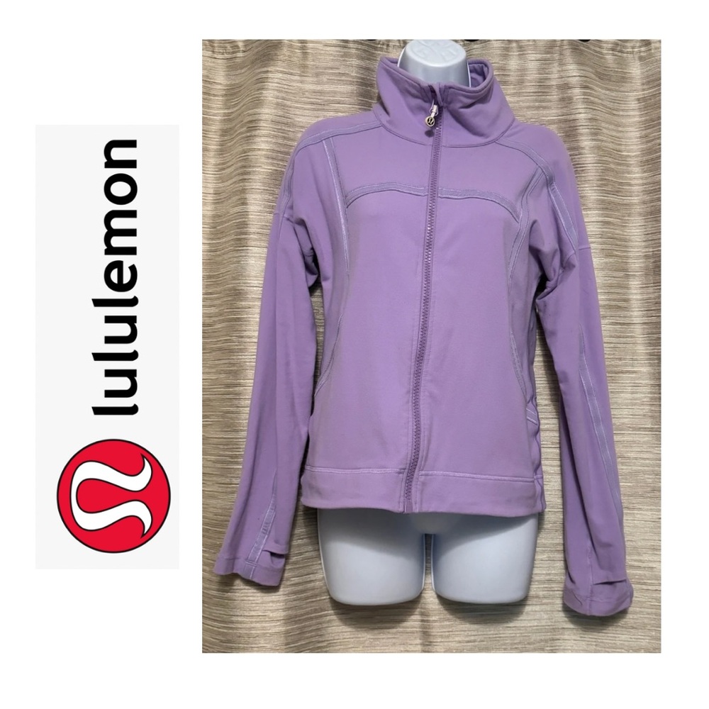 Zip up jacket with thumb holes and pockets